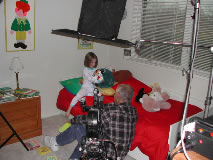 A father puts his daughter to bed in a scene for Good Samaritan Hospital. 
