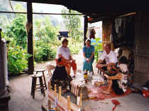 Preproduction team talks to Atayal weavers. L-R  Sylvia T., Kathy T., Columban Fr. Tom Browning, Atayal women.